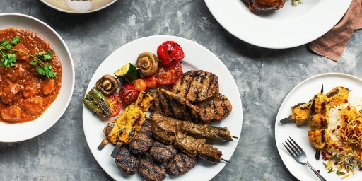 Drop Off Catering Victoria Plates on a table with middle eastern food