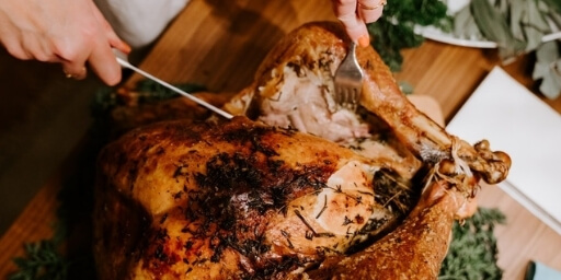 Holiday dinner catering Turkey being carved